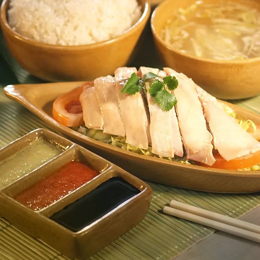 Steamed white chicken sliced over rice, served with chilli, ginger and dark soya dips